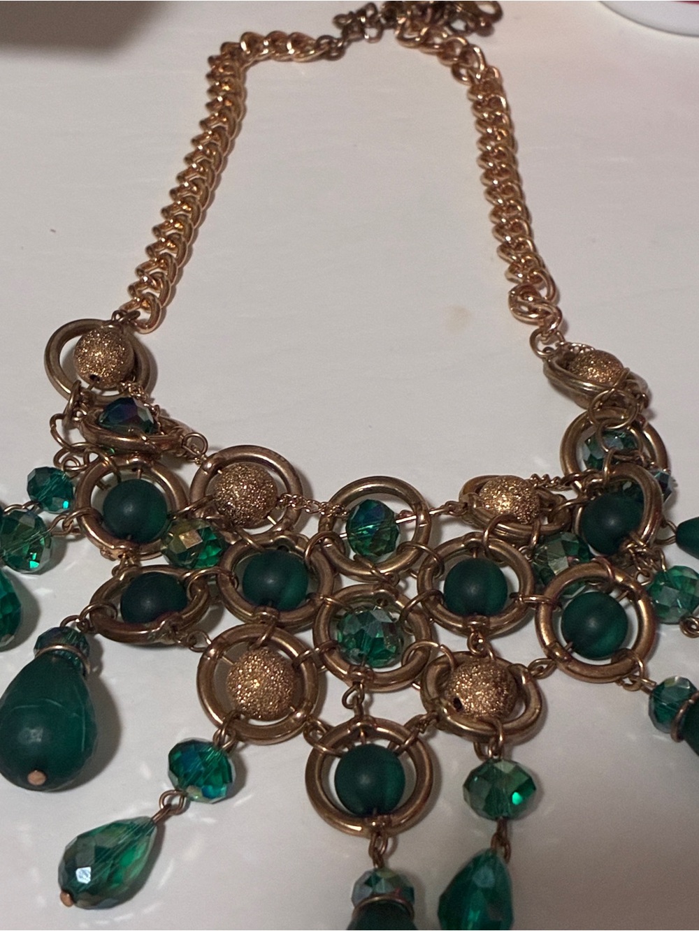 Gold-Tone Statement Necklace with Emerald Green Accents